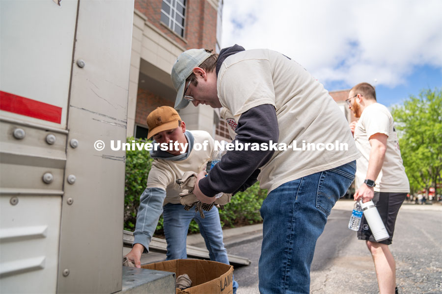 Quinny Brumbaugh (left) and Tyson Shields (right) grab gloves before heading to their location for the Big Event. May 4, 2024. Photo by Kirk Rangel for University Communication.
